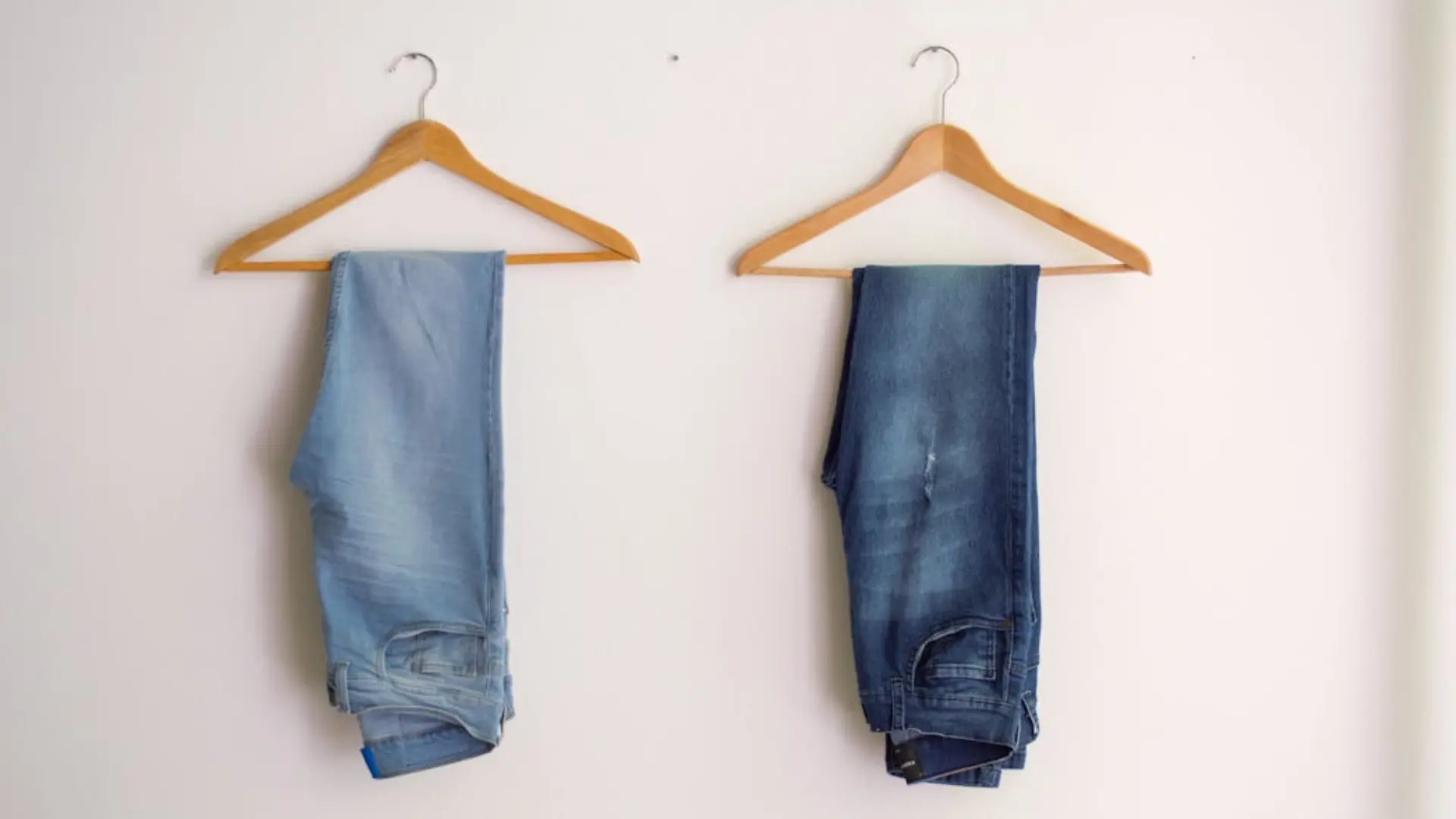 Variety of wooden, plastic, and metal hangers with custom logos